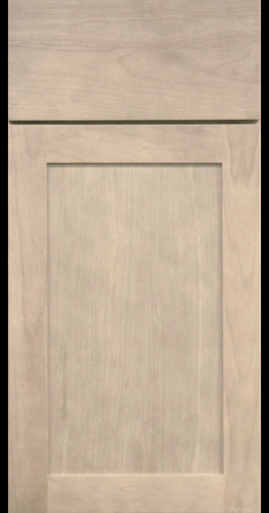 Light Stain Finish on shaker cabinet door with matching Slab Drawer Front.