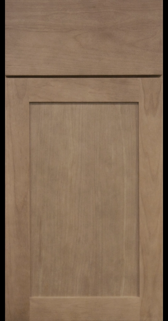 Medium Dark Stain Finish on shaker cabinet door with matching Slab Drawer Front.